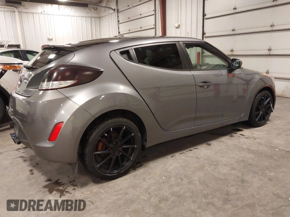 2016 Hyundai Veloster with VIN KMHTC6ADXGU272594, listed as a IAAI auction lot 42437409 with 91,620 mi miles and . Bid and sale history available at DreamBid. Image 4.