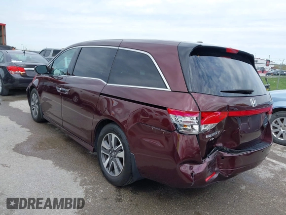 2014 Honda Odyssey Touring with VIN 5FNRL5H9XEB073156, listed as a IAAI auction lot 41990714 with 166,129 mi miles and . Bid and sale history available at DreamBid. Image 3.