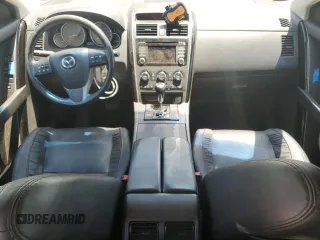 2014 Mazda CX-9 Touring with VIN JM3TB3CA6E0441708, listed as a Copart auction lot 61143785 with 173,562 mi miles and Salvage title. Bid and sale history available at DreamBid. Image 8.