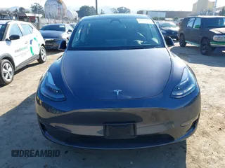 2023 Tesla Model Y Long Range with VIN 7SAYGAEE5PF964083, listed as a IAAI auction lot 41365919 with 26,008 mi miles and . Bid and sale history available at carsss.com. Image 13.
