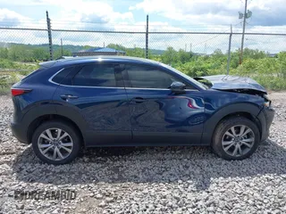 2021 Mazda CX-30 Premium z VIN 3MVDMBDL7MM236474, wystawiony jako IAAI lot #42284515 z przebiegiem 58 565 mil mil oraz . Historia ofert i sprzedaży dostępna na DreamBid. Obrazek 13.