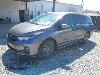 2025 Honda Odyssey Touring z VIN 5FNRL6H84SB028769, wystawiony jako IAAI lot #41856080 z przebiegiem Nie podano mil oraz . Historia ofert i sprzedaży dostępna na DreamBid. Obrazek 16.