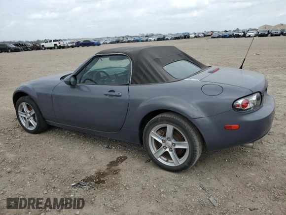2007 Mazda MX-5 Miata Sport z VIN JM1NC25F970134960, wystawiony jako Copart lot #48422265 z przebiegiem 149 357 mil mil oraz Czysty tytuł • Clean title. Historia ofert i sprzedaży dostępna na DreamBid. Obrazek 2.