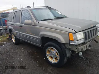 1998 Jeep Grand Cherokee Limited with VIN 1J4GZ78YXWC236969, listed as a IAAI auction lot 41095686 with 182,001 mi miles. Bid and sale history available at carsss.com. Image 1.