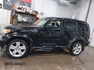2011 Dodge Nitro Heat with VIN 1D4PU4GK1BW602572, listed as a IAAI auction lot 41529030 with 134,482 mi miles. Bid and sale history available at carsss.com. Image 14.
