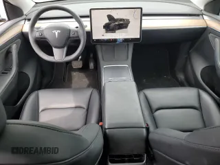 2023 Tesla Model Y Long Range z VIN 7SAYGDEE0PF869710, wystawiony jako Copart lot #52885365 z przebiegiem 13 919 mil mil oraz Szkoda całkowita • Salvage title. Historia ofert i sprzedaży dostępna na DreamBid. Obrazek 8.