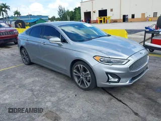 2020 Ford Fusion Titanium with VIN 3FA6P0D95LR199443, listed as a IAAI auction lot 42721371 with 77,592 mi miles and . Bid and sale history available at DreamBid. Image 1.