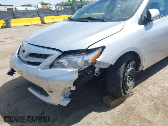 2011 Toyota Corolla L with VIN 2T1BU4EE1BC572731, listed as a IAAI auction lot 42024851 with 153,923 mi miles. Bid and sale history available at carsss.com. Image 6.