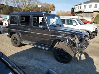 2015 Mercedes-Benz G 550 with VIN WDCYC3HF4FX239064, listed as a Copart auction lot 77151664 with 65,854 mi miles and Salvage Title. Bid and sale history available at DreamBid. Image 4.