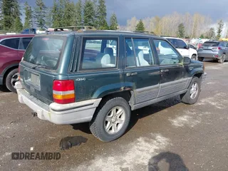 1995 Jeep Grand Cherokee Laredo with VIN 1J4GZ58SXSC676393, listed as a IAAI auction lot 41943464 with 244,317 mi miles. Bid and sale history available at carsss.com. Image 4.