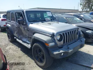 2021 Jeep Wrangler Unlimited Sport Altitude with VIN 1C4HJXDGXMW662493, listed as a IAAI auction lot 41288957 with 64,808 mi miles and . Bid and sale history available at DreamBid. Image 1.