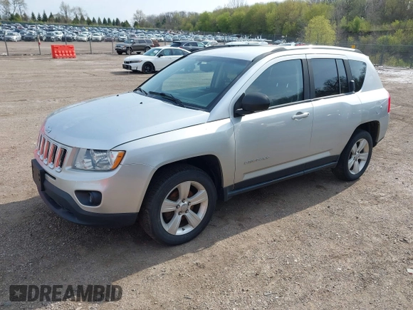 2013 Jeep Compass Sport with VIN 1C4NJDBB4DD119077, listed as a IAAI auction lot 42142532 with 131,679 mi miles. Bid and sale history available at carsss.com. Image 2.