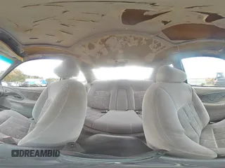 1996 Ford Thunderbird LX z VIN 1FALP62W7TH135632, wystawiony jako Copart lot #77134024 z przebiegiem 128 931 mil mil oraz Szkoda całkowita • Salvage title. Historia ofert i sprzedaży dostępna na DreamBid. Obrazek 13.