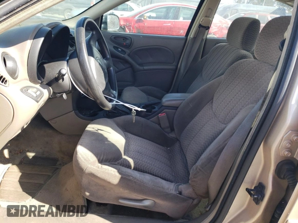 2001 Pontiac Grand Am SE z VIN 1G2NE52T91M583582, wystawiony jako Copart lot #77808974 z przebiegiem 126 219 mil mil oraz Szkoda całkowita • Salvage title. Historia ofert i sprzedaży dostępna na DreamBid. Obrazek 7.