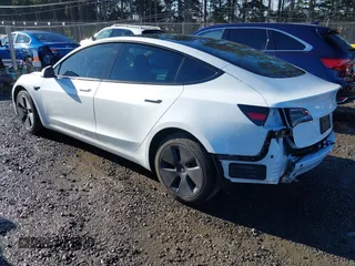 2023 Tesla Model 3 z VIN 5YJ3E1EA0PF611244, wystawiony jako IAAI lot #41455102 z przebiegiem 21 867 mil mil oraz . Historia ofert i sprzedaży dostępna na DreamBid. Obrazek 3.