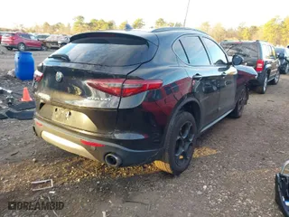 2018 Alfa Romeo Stelvio Sport with VIN ZASFAKPNXJ7B59211, listed as a IAAI auction lot 41099083 with 60,695 mi miles. Bid and sale history available at carsss.com. Image 4.