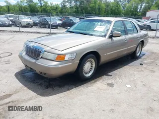 2001 Mercury Grand Marquis LS z VIN 2MEFM75W31X704182, wystawiony jako IAAI lot #42086175 z przebiegiem 177 892 mil mil oraz . Historia ofert i sprzedaży dostępna na DreamBid. Obrazek 2.