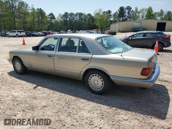1991 Mercedes-Benz 560 with VIN WDBCA39E9MA599487, listed as a Copart auction lot 51921915 with 59,132 mi miles and Salvage Title. Bid and sale history available at DreamBid. Image 2.
