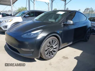 2022 Tesla Model Y Performance z VIN 7SAYGDEF0NF491586, wystawiony jako IAAI lot #42276747 z przebiegiem 117 203 mil mil oraz . Historia ofert i sprzedaży dostępna na DreamBid. Obrazek 2.