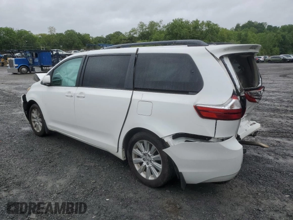 2015 Toyota Sienna LE with VIN 5TDJK3DCXFS126604, listed as a Copart auction lot 56987355 with 102,079 mi miles and Salvage title. Bid and sale history available at DreamBid. Image 2.