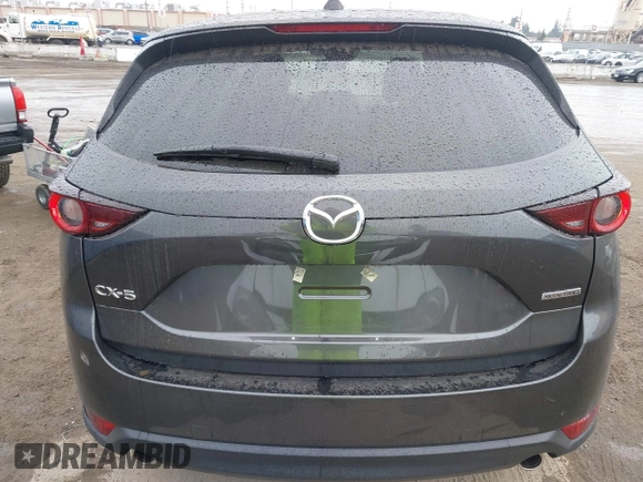 2021 Mazda CX-5 Touring with VIN JM3KFACM6M0480487, listed as a IAAI auction lot 41731646 with 26,951 mi miles and . Bid and sale history available at carsss.com. Image 17.