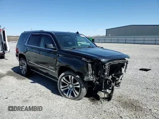 2015 GMC Yukon Denali with VIN 1GKS2CKJ5FR612147, listed as a Copart auction lot 49209525 with 127,262 mi miles and Salvage Title. Bid and sale history available at carsss.com. Image 12.