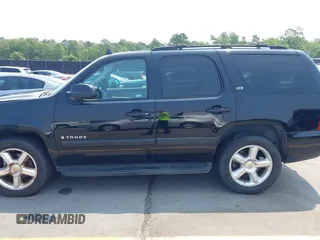 2007 Chevrolet Tahoe LTZ with VIN 1GNFC13007R111180, listed as a IAAI auction lot 42381749 with 126,472 mi miles and . Bid and sale history available at DreamBid. Image 14.