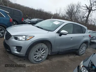 2016 Mazda CX-5 Sport with VIN JM3KE2BY5G0647715, listed as a IAAI auction lot 41831228 with 89,689 mi miles and . Bid and sale history available at carsss.com. Image 14.