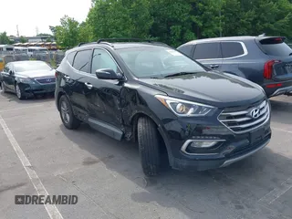 2017 Hyundai Santa Fe 2.4L z VIN 5NMZUDLB4HH030064, wystawiony jako IAAI lot #42288147 z przebiegiem 89 297 mil mil oraz . Historia ofert i sprzedaży dostępna na DreamBid. Obrazek 1.