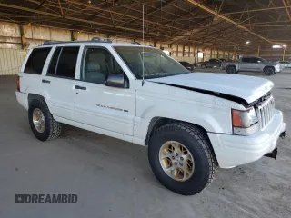 1996 Jeep Grand Cherokee with VIN 1J4EZ78Y9TC104398, listed as a Copart auction lot 69706254 with Not provided miles and Salvage title. Bid and sale history available at DreamBid. Image 4.