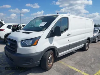 2020 Ford Transit Cargo with VIN 1FTYE1Y8XLKB80973, listed as a IAAI auction lot 41707281 with 112,721 mi miles and . Bid and sale history available at DreamBid. Image 2.