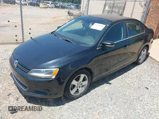 2014 Volkswagen Jetta TDI w/Premium with VIN 3VW3L7AJ6EM420044, listed as a IAAI auction lot 42569620 with 143,482 mi miles and . Bid and sale history available at DreamBid. Image 2.