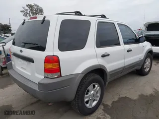 2001 Ford Escape XLT with VIN 1FMYU03121KB61138, listed as a IAAI auction lot 42044869 with 164,698 mi miles. Bid and sale history available at carsss.com. Image 4.