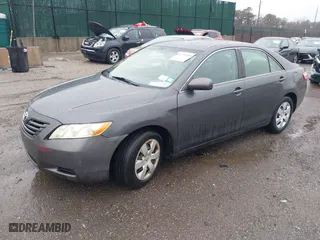 2007 Toyota Camry CE with VIN 4T1BE46K77U688152, listed as a IAAI auction lot 41799406 with 152,033 mi miles. Bid and sale history available at carsss.com. Image 2.