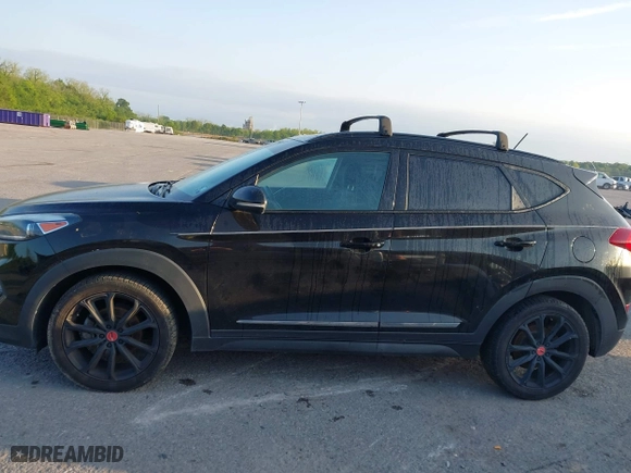 2017 Hyundai Tucson Value with VIN KM8J33A2XHU462806, listed as a IAAI auction lot 42045963 with 102,678 mi miles. Bid and sale history available at carsss.com. Image 14.