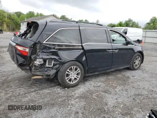 2013 Honda Odyssey EX-L with VIN 5FNRL5H69DB031498, listed as a Copart auction lot 55459745 with 129,773 mi miles and Salvage title. Bid and sale history available at DreamBid. Image 3.