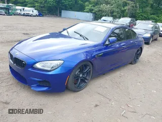 2014 BMW M6 z VIN WBS6C9C54EDV73943, wystawiony jako IAAI lot #42294944 z przebiegiem 129 823 mil mil oraz . Historia ofert i sprzedaży dostępna na DreamBid. Obrazek 2.