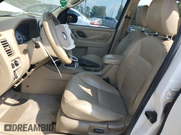 2005 Ford Escape XLT with VIN 1FMYU031X5KB24232, listed as a Copart auction lot 74798104 with 166,828 mi miles and Salvage Title. Bid and sale history available at carsss.com. Image 7.