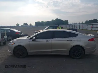 2018 Ford Fusion SE z VIN 3FA6P0HD6JR279927, wystawiony jako IAAI lot #42430172 z przebiegiem 145 080 mil mil oraz . Historia ofert i sprzedaży dostępna na DreamBid. Obrazek 14.