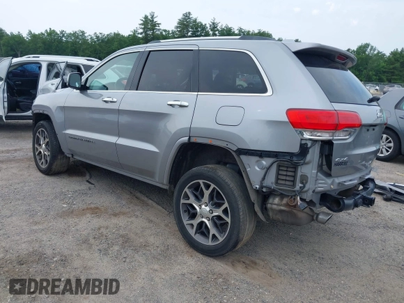 2019 Jeep Grand Cherokee High Altitude with VIN 1C4RJFCG1KC570199, listed as a IAAI auction lot 42464644 with 94,126 mi miles and . Bid and sale history available at DreamBid. Image 3.