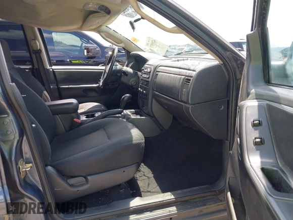 2004 Jeep Grand Cherokee Laredo with VIN 1J4GX48S44C205469, listed as a IAAI auction lot 42310571 with 154,929 mi miles and . Bid and sale history available at DreamBid. Image 5.