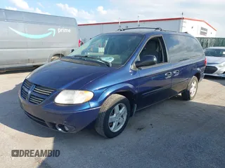 2005 Dodge Caravan SXT with VIN 2D4GP44L65R565519, listed as a IAAI auction lot 42730269 with 124,848 mi miles and . Bid and sale history available at DreamBid. Image 2.