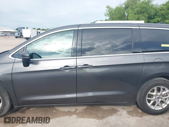 2023 Chrysler Pacifica Touring L with VIN 2C4RC1BG8PR594481, listed as a IAAI auction lot 42618839 with 60,748 mi miles and . Bid and sale history available at DreamBid. Image 14.