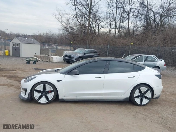 2021 Tesla Model 3 Performance with VIN 5YJ3E1EC5MF059625, listed as a IAAI auction lot 41652748 with 63,287 mi miles. Bid and sale history available at carsss.com. Image 14.