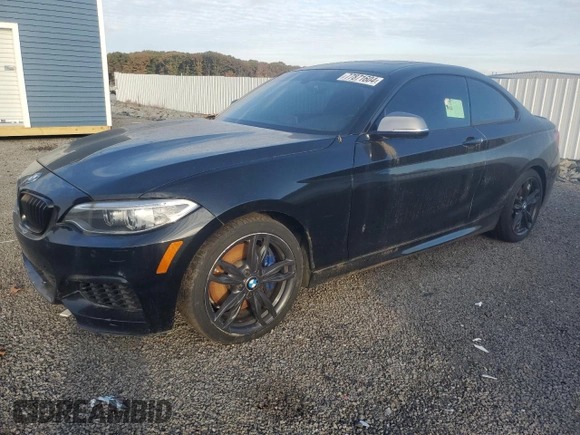 2016 BMW 2 Series M235i xDrive with VIN WBA1J9C57GV371986, listed as a Copart auction lot 77871604 with 0 mi miles and Salvage Title. Bid and sale history available at carsss.com. Image 1.