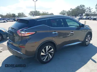 2015 Nissan Murano Platinum z VIN 5N1AZ2MG7FN230347, wystawiony jako IAAI lot #41545220 z przebiegiem 134 435 mil mil oraz . Historia ofert i sprzedaży dostępna na DreamBid. Obrazek 4.