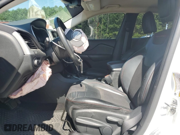 2015 Jeep Cherokee Trailhawk with VIN 1C4PJMBS0FW705288, listed as a Copart auction lot 61796275 with 133,874 mi miles and Salvage title. Bid and sale history available at DreamBid. Image 7.
