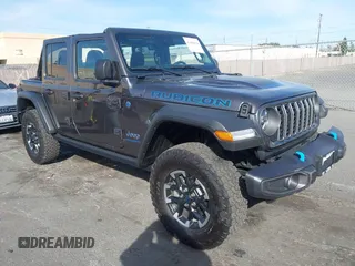 2024 Jeep Wrangler Rubicon z VIN 1C4RJXR60RW279691, wystawiony jako IAAI lot #41402558 z przebiegiem 1 134 mil mil oraz . Historia ofert i sprzedaży dostępna na DreamBid. Obrazek 1.