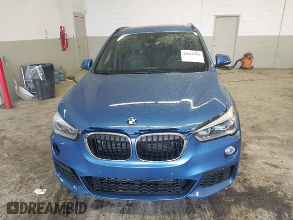 2019 BMW X1 xDrive28i with VIN WBXHT3C53K5L36690, listed as a IAAI auction lot 42012992 with 70,339 mi miles. Bid and sale history available at carsss.com. Image 12.