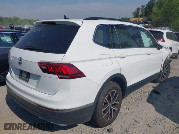 2021 Volkswagen Tiguan SE with VIN 3VV3B7AX7MM080266, listed as a IAAI auction lot 42062147 with 66,786 mi miles and . Bid and sale history available at DreamBid. Image 4.